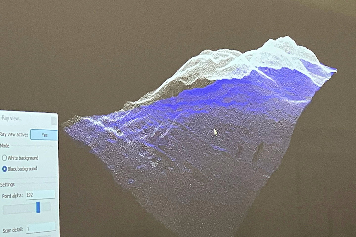 A blue and white image generated by a lidar scan of a pile of simulated lunar regolith.