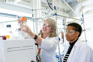 Jennifer West with a student in a chemical engineering lab