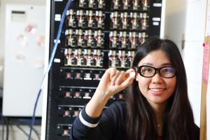 a student holds up a sample