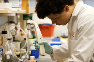 Malcolm O'Malley works at a lab bench