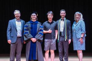 The Dean and the Associate Dean for Graduate Education and Post-Doctoral Affairs pose with three Outstanding Student Awardees
