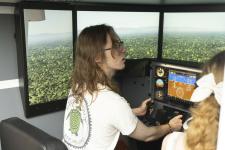 Visitors giving the flight simulator a try
