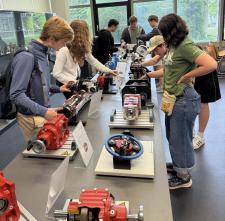 Students studying machinery