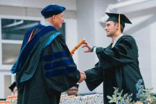 A student receives their diploma