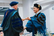 A student receives their diploma