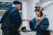 A student receives their diploma