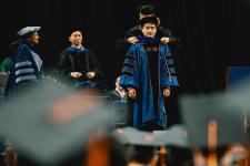 A student is hooded