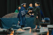 A student receives their diploma