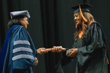 A B.S. student receives her diploma