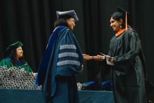 A student receives their diploma