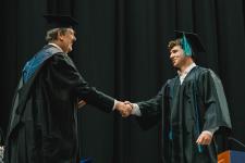 A student receives their diploma