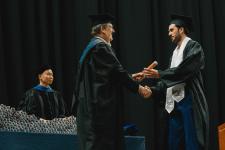A student receives their diploma