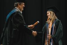 A student receives their diploma