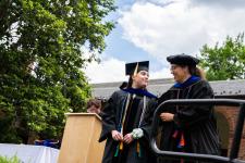 PhD graduate is hooded