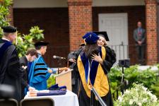 students receive diplomas