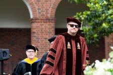 Faculty member enters the ceremony