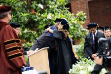 Student hugs a faculty member