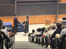 A student receives her diploma