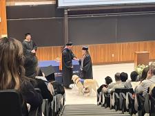 A chemical engineering student receives her diploma
