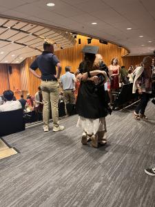 A student embraces a family member