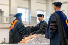 A student receives their diploma