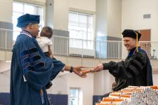 A student receives their diploma