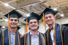 Students wait in line to receive their diplomas