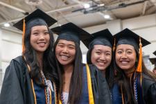 Students wait in line to receive their diplomas