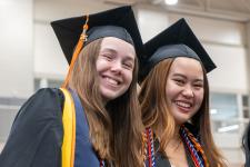 Students wait in line to receive their diplomas