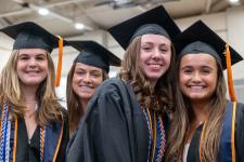 Students wait in line to receive their diplomas