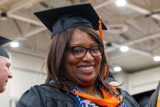 Students wait in line to receive their diplomas