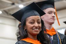 Students wait in line to receive their diplomas