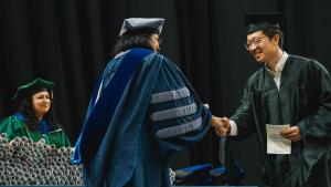 A student receives their diploma