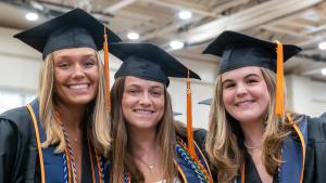 Students wait in line to receive their diplomas