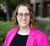 Image of Amy wearing pink jacket, smiling