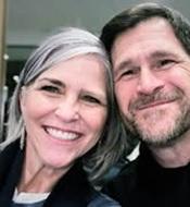 Image of Amy, on the left, smiling.