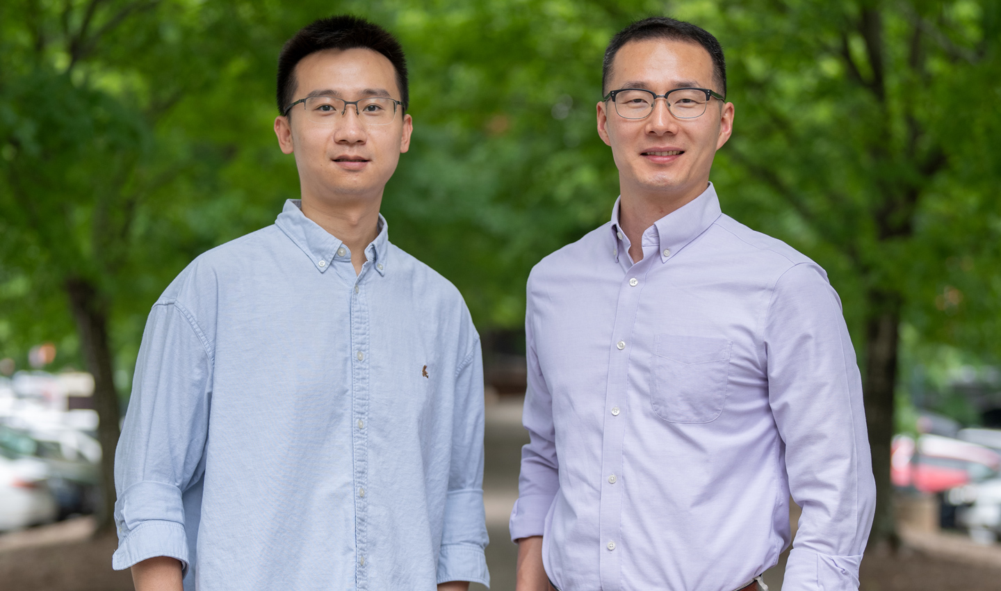 Two men standing next to each other