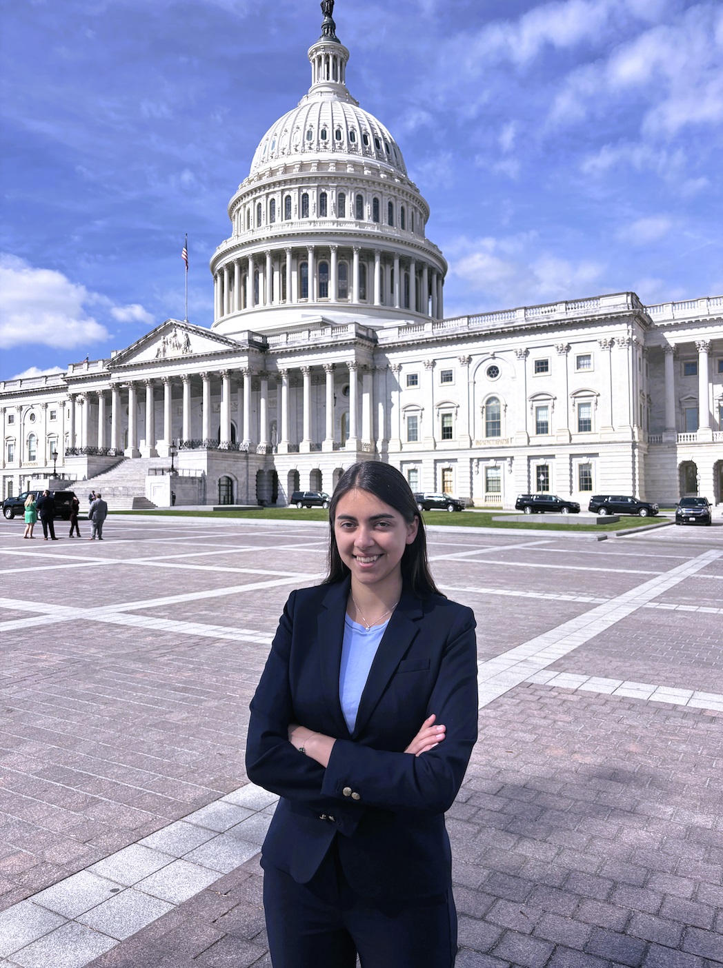 Ojha stands outside of the U.S. Capitol. (Photo courtesy of Lara Ojha)