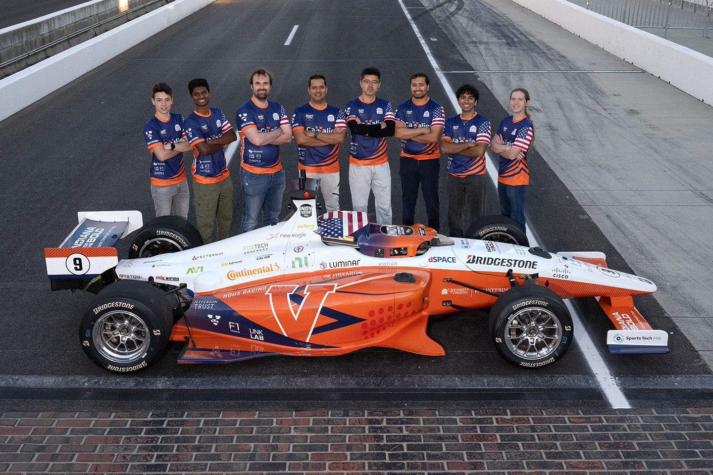 UVA Cavalier Racing Team posing with their autonomous racecar