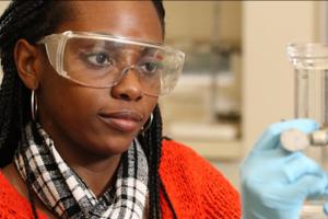 Chemical engineering graduate student working in lab