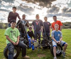 Baja racing team students with their car