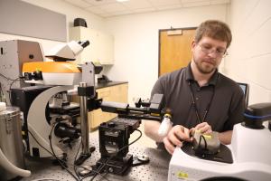 Joe Thompson working on the Renishaw Raman Spectrometer