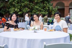 Students at a table during the picnic