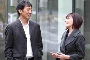 a man speaks with a woman