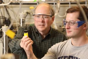 Prof. Bob Davis works with a student in his lab