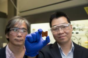 Prof Josh Choi looks at a sample of material