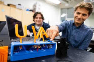 Students display a device developed in Engineering Foundations