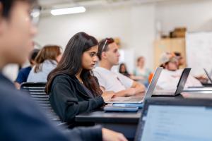 A student looks at a laptop during an Engineering Foundations class