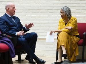 Pierson speaks to Rosalyn Berne before the formal talk.