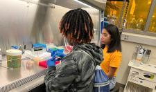High school student working with CHE grad student mentor in chemical engineering lab